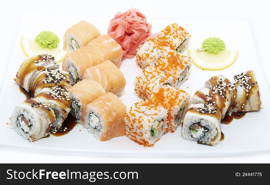 Japanese sushi with eel and salmon on a white plate