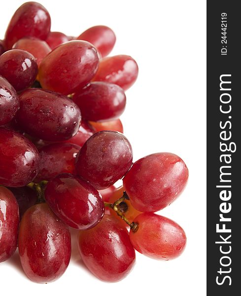 Red seedless grapes on a white background. Red seedless grapes on a white background