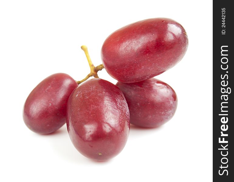 Red seedless grapes on a white background. Red seedless grapes on a white background