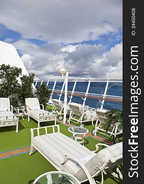 Sunbeds on open deck of the cruise ship on sunny day. Sunbeds on open deck of the cruise ship on sunny day