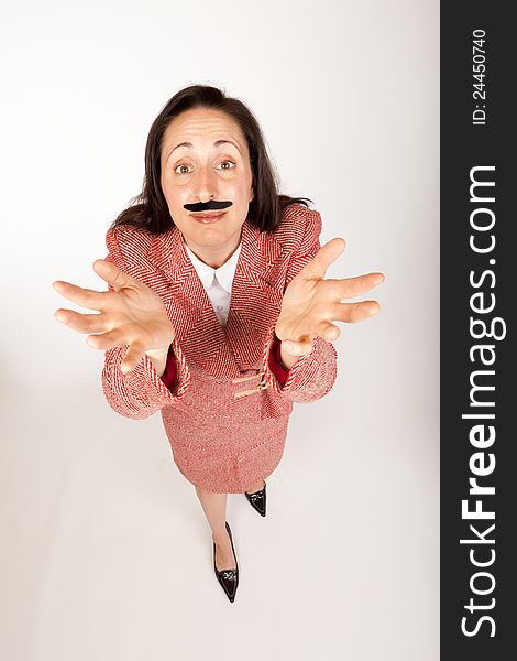 Humorous shot of a silly looking businesswoman with a binder and a fake mustache and outstretched hands. Humorous shot of a silly looking businesswoman with a binder and a fake mustache and outstretched hands