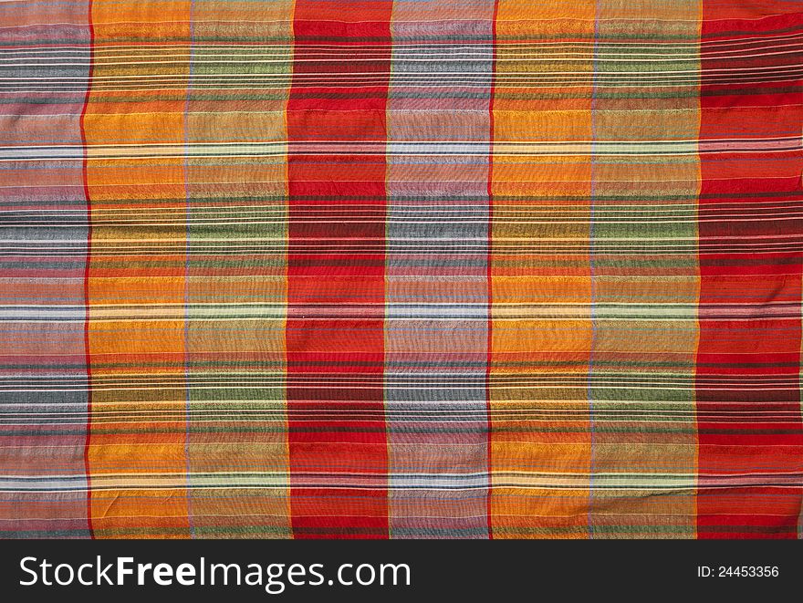 Close-up of multicoloured fabric with geometric pattern
