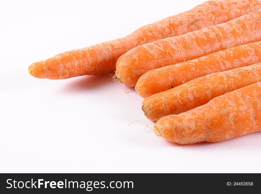 Raw carrots on the white