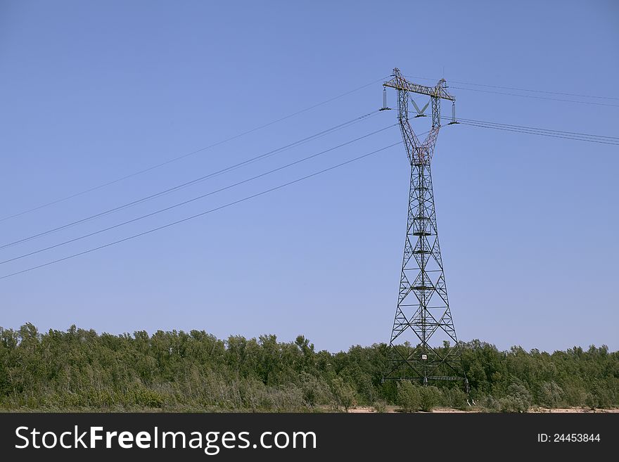 Power transmission tower against blue sky. Power transmission tower against blue sky