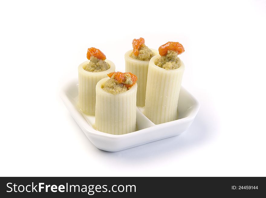 Aperitif in the ceramic plates on a white background