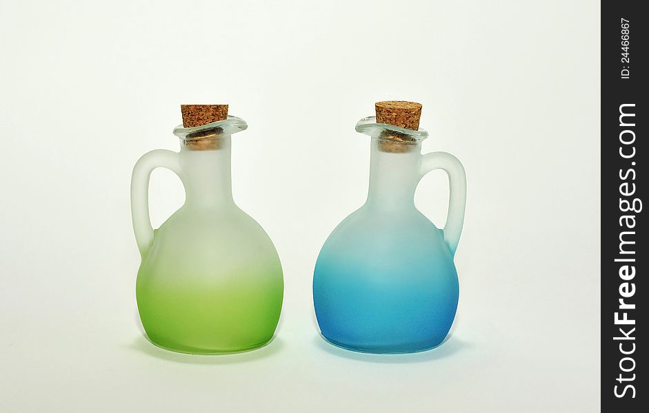 Isolated green and blue bottles. Clipping mask.