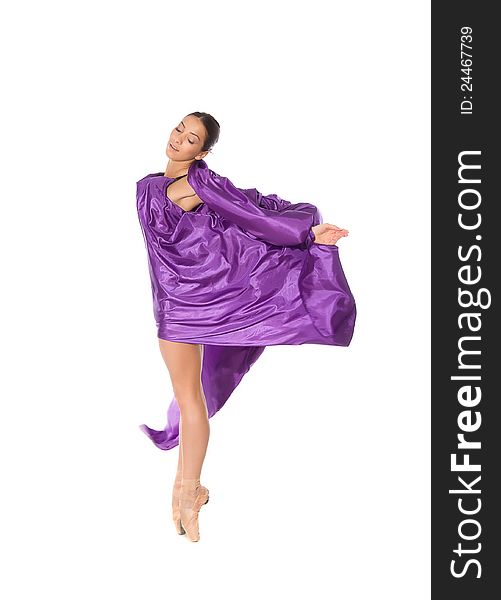 Ballet dancer in purple fabric isolated on white background. Ballet dancer in purple fabric isolated on white background
