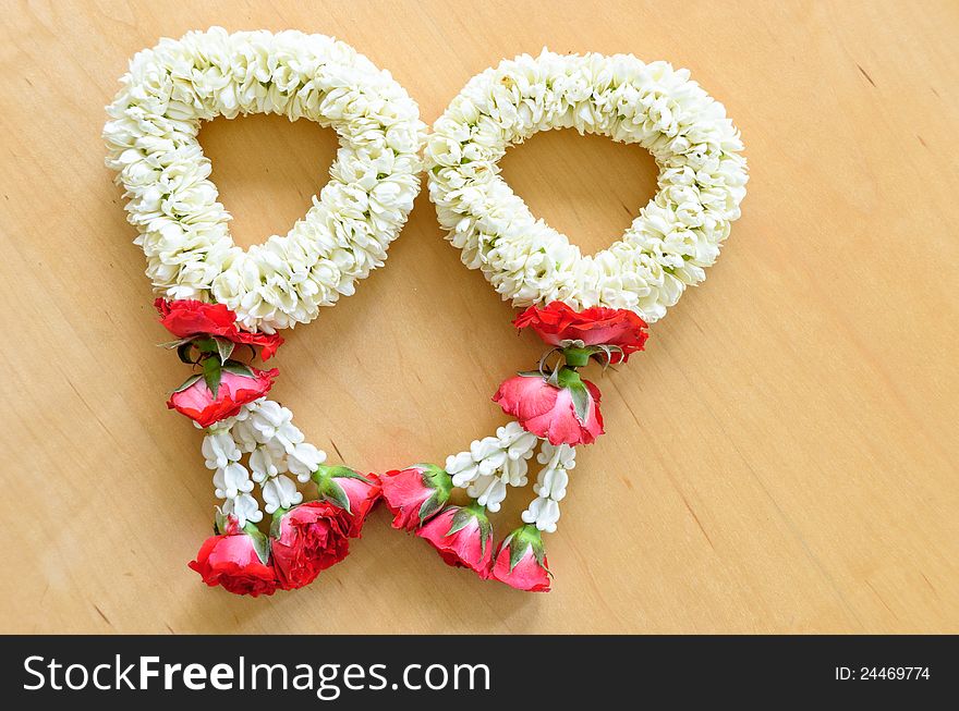 Close up top view pair of thai style garland on wood background