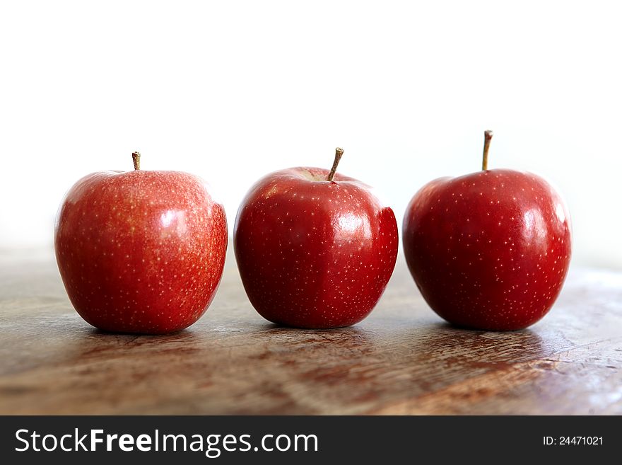 Fresh red apples on a wooden table. Fresh red apples on a wooden table.