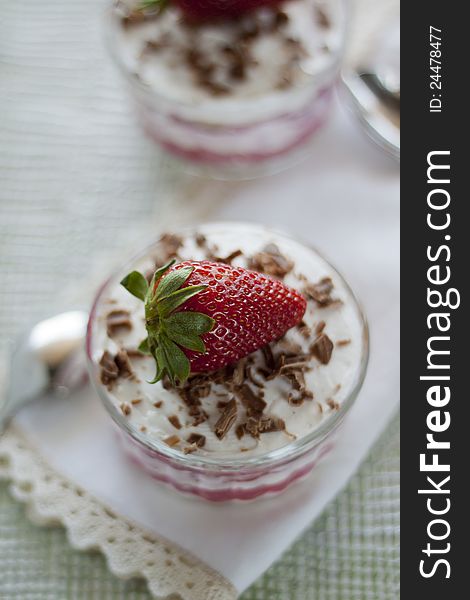 Bowl with whipped cream and strawberries