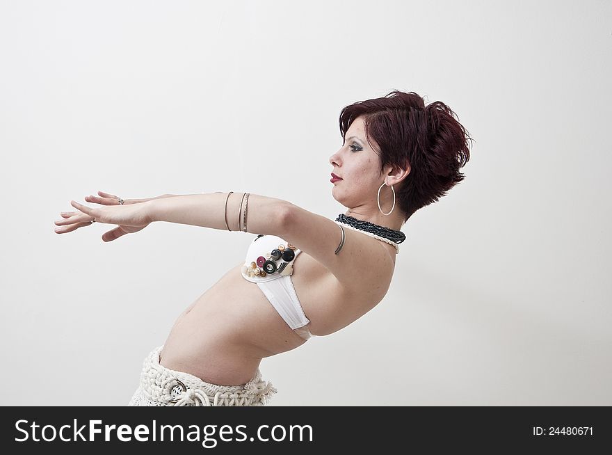 Beautiful tribal dancer photographed on white background. Beautiful tribal dancer photographed on white background