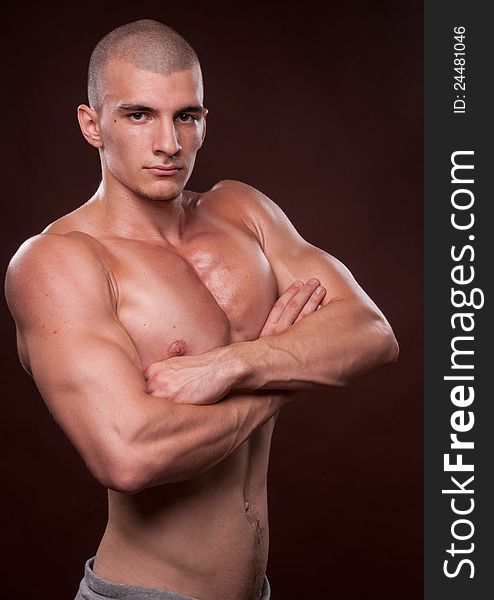 Muscled male model posing in studio. Muscled male model posing in studio