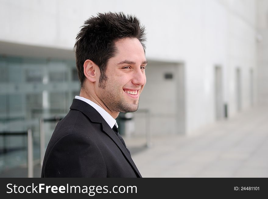 Portrait of a handsome young businessman laughing