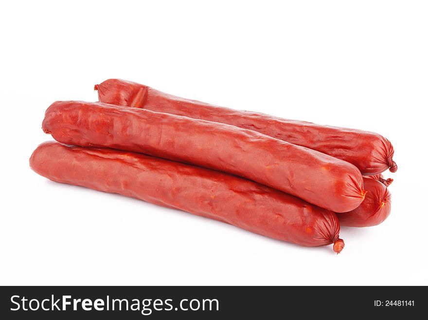 Raw red sausage on a white background