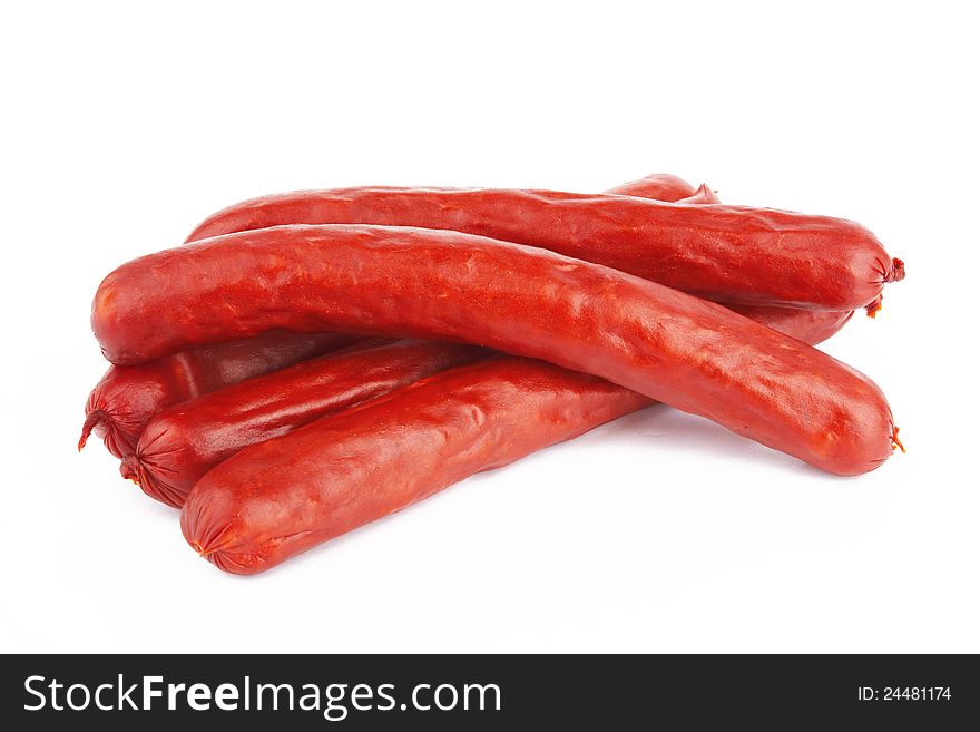 Raw red sausage on a white background