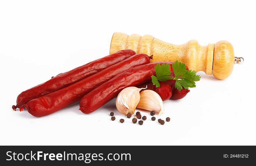 Sausage arranged with parsley on white background