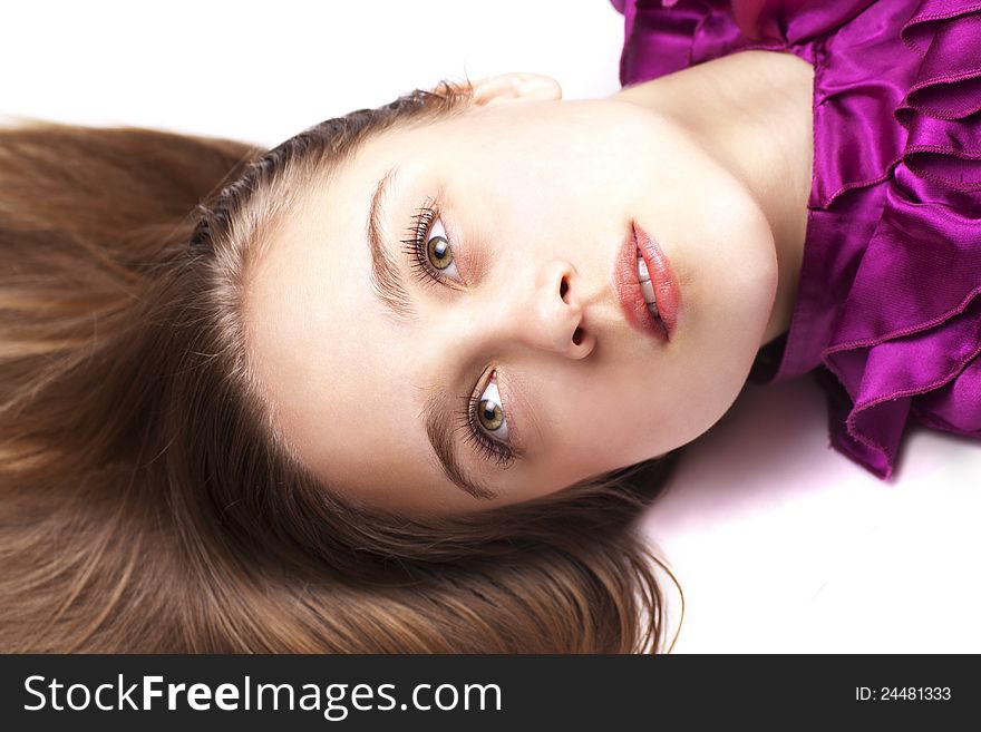 Closeup portrait of sexsual young woman posing while lying on floor. Closeup portrait of sexsual young woman posing while lying on floor