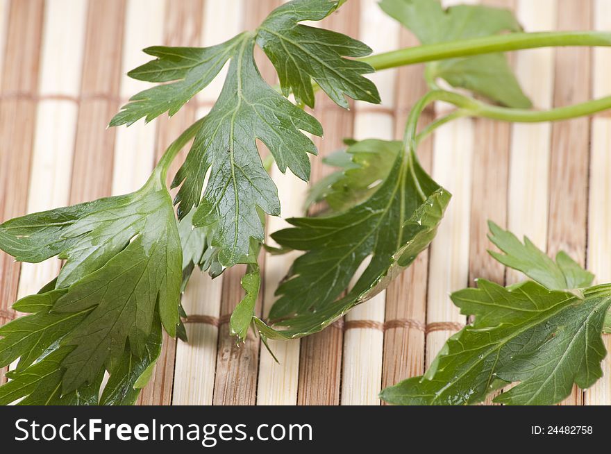 Parsley leaf on bamboo background