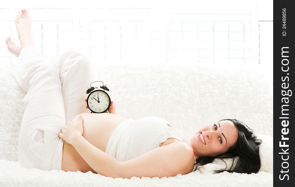 Pregnant Woman Lying On The Sofa