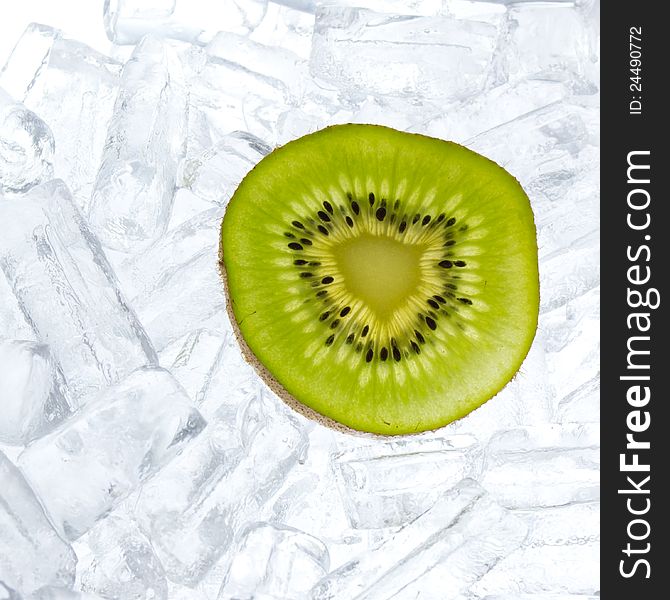 Kiwifruit slice on fresh ice background. Kiwifruit slice on fresh ice background