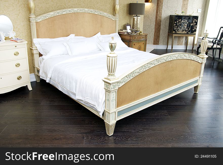 Bedroom with a queen size bed and bedside table