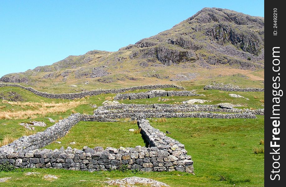 Landscape shot of the Ruins of the Roman Fort on the Hardknott pass in Cumbria, England. Landscape shot of the Ruins of the Roman Fort on the Hardknott pass in Cumbria, England.