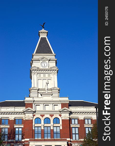 A building and a tall clock tower