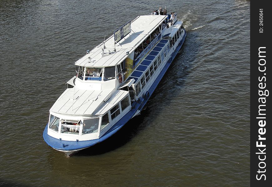 Passenger ship on the river wirh dirty water