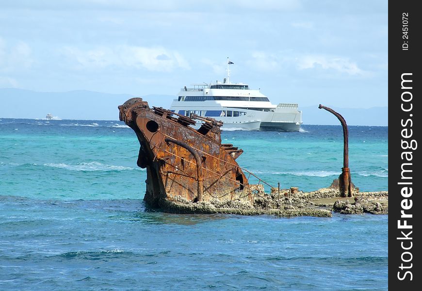 Barge sailing pass shipwrecks at Morton island