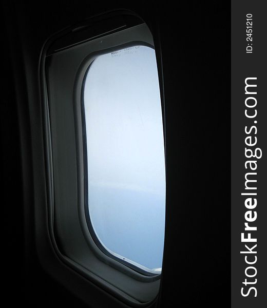 Looking outside the window of a plane. Looking outside the window of a plane