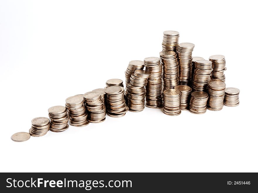 Increasing pyramid of small coins on a white background. Increasing pyramid of small coins on a white background