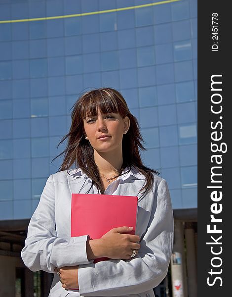 Businesswoman downtown holding a file