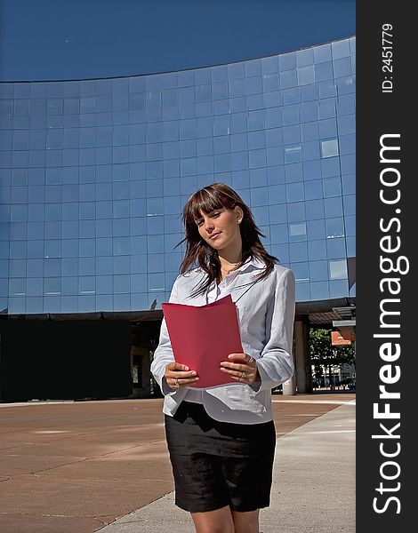 Businesswoman downtown holding a file