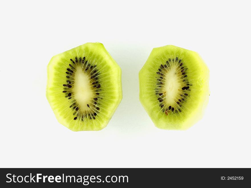 Two Kiwi fruit segments on a white background