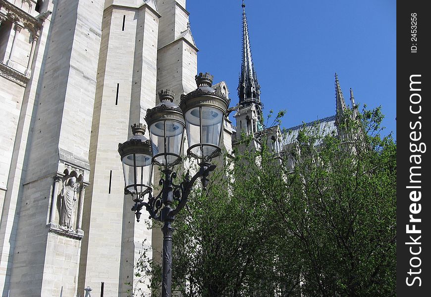 From the side of notre-dame de paris, scupture and gothic architecture. From the side of notre-dame de paris, scupture and gothic architecture