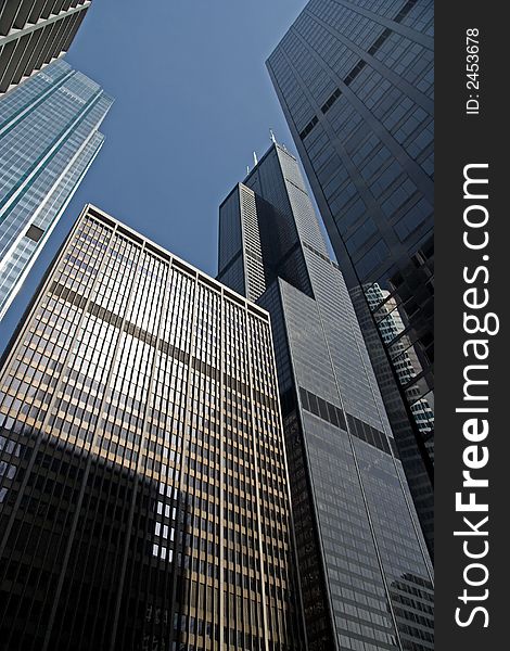 A view looking up at the skyscrapers in the financial district of Chicago, IL.