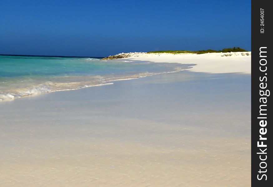 Wonderful white beach in trpoical island under blue sky. Wonderful white beach in trpoical island under blue sky