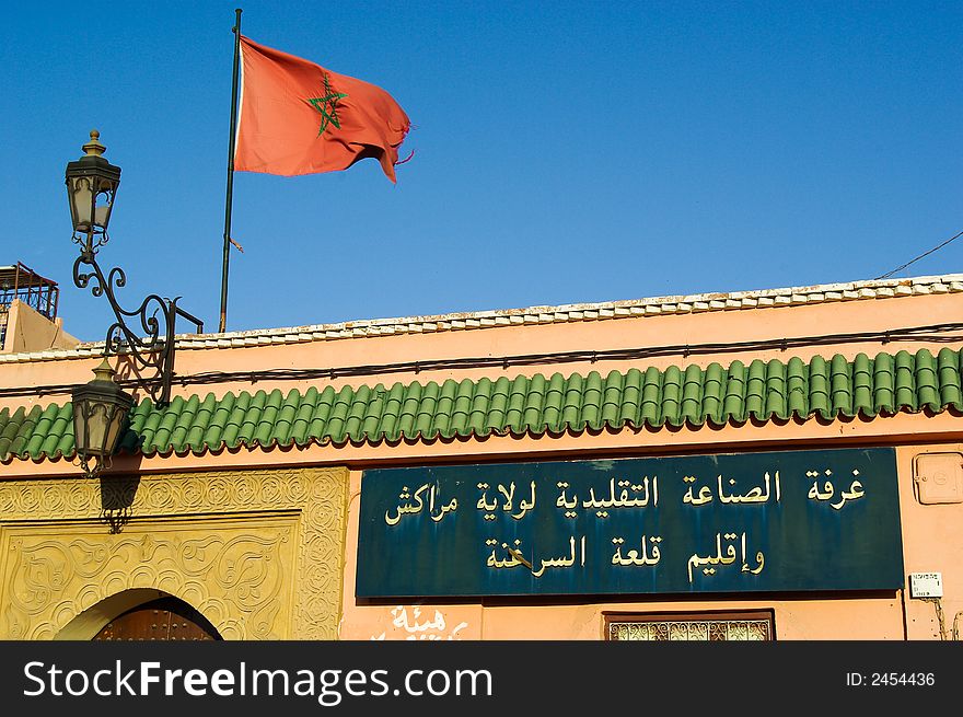 Palace with moroccan flags in djema el fna square, Marrakech