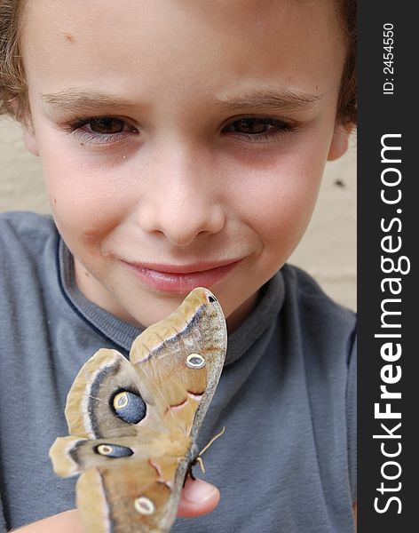 Boy Holding Poly Anheria Moth