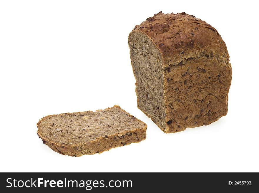 Loaf of cereal rye bread and slice isolated on white background