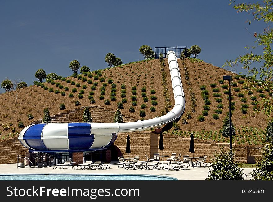 A fully enclosed downhill water slide