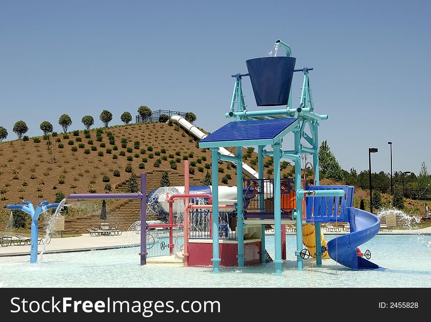 A swimming pool area with a waterpark for children. A swimming pool area with a waterpark for children