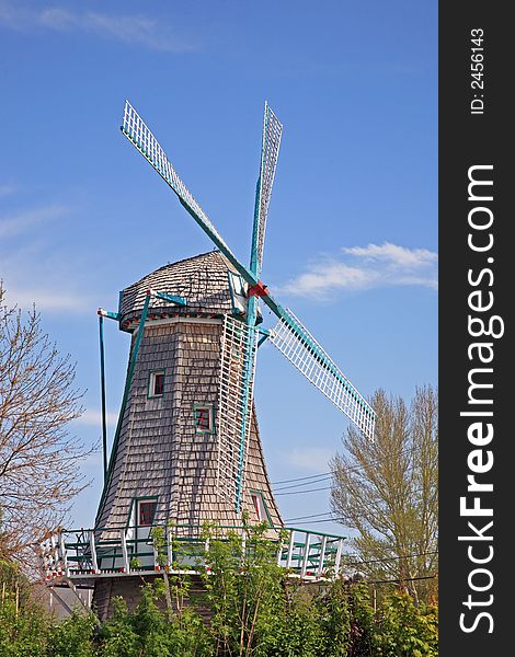 An old windmill in an early spring setting.