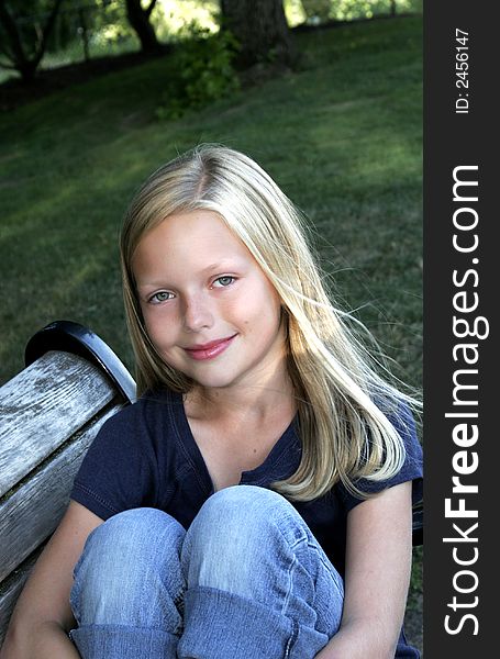 Image of a preteen girl in  park setting. Image of a preteen girl in  park setting