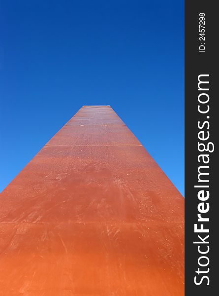 Shot looking up the long arm of a huge sundial on a clear day in Cave Creek, Arizona. Shot looking up the long arm of a huge sundial on a clear day in Cave Creek, Arizona.