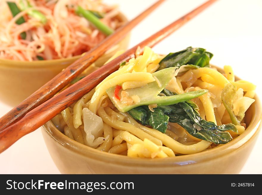 Bowls of fried noodles on a white background. Bowls of fried noodles on a white background