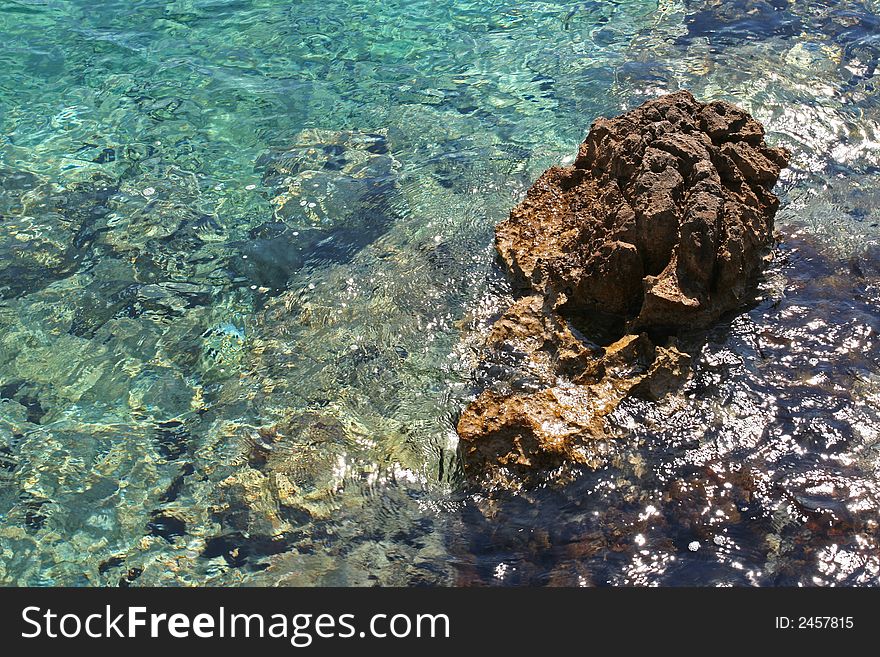 Turquoise Mediterranean water with rock formation