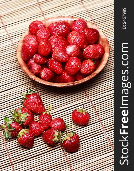 Fresh strawberries on a wooden surface