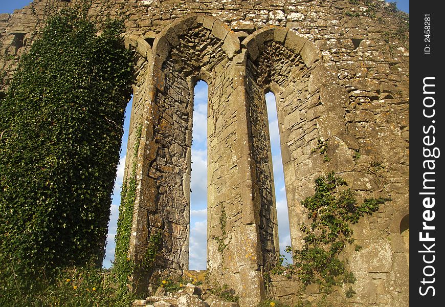 Close up of historic church window in 10th century ruins located in county Clare, Ireland