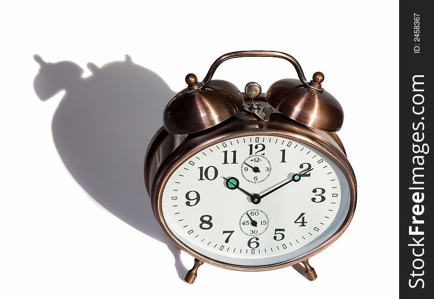 Isolated bronze vintage alarm clock with shadow